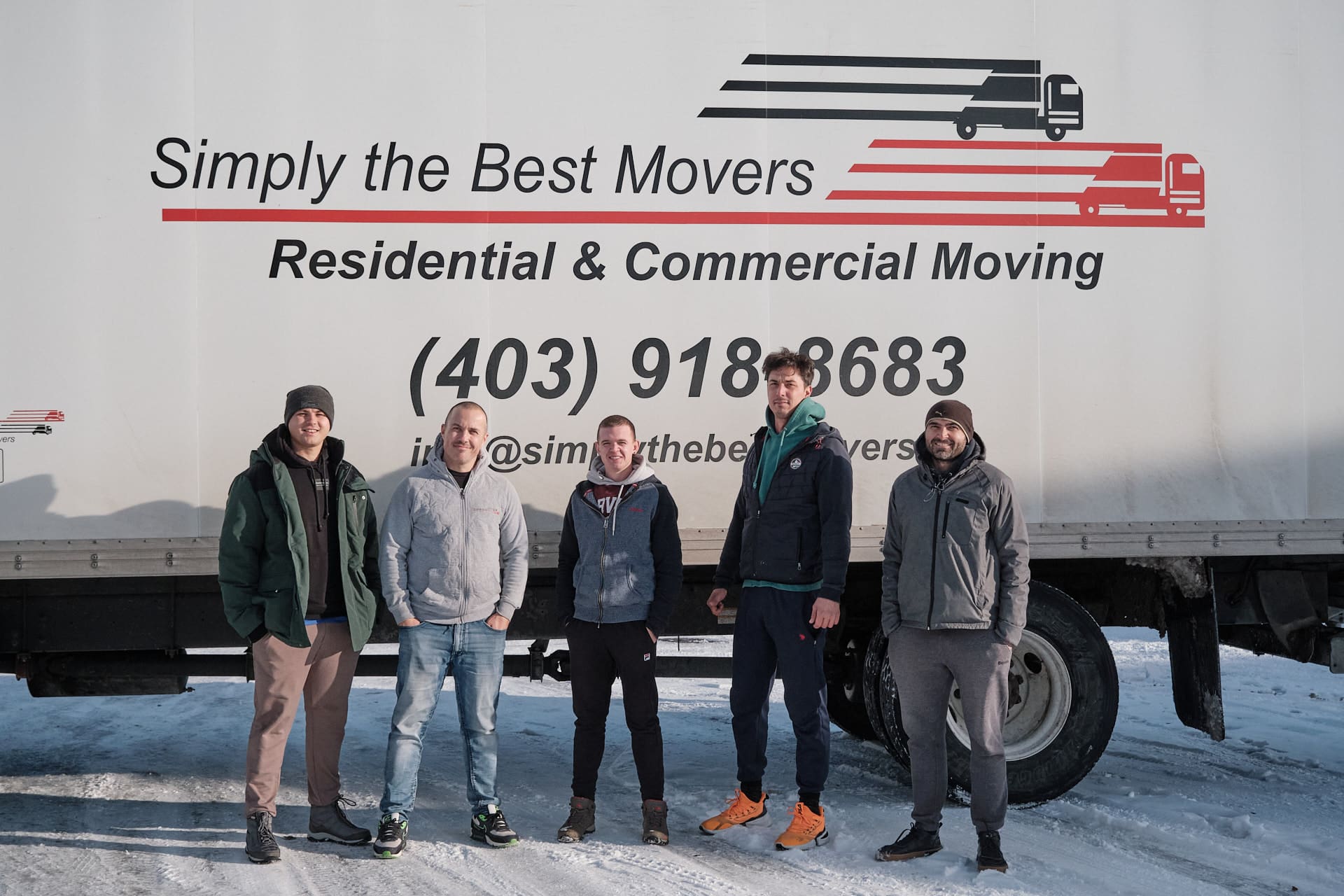 Lethbridge movers standing in front of a moving truck