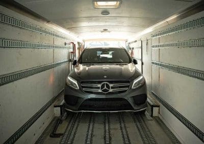 Mercedes SUV being loaded in the car hauling trailer